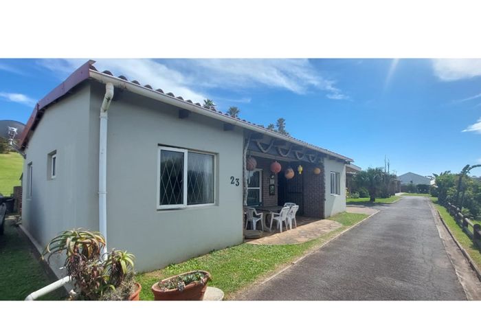 Coastal house for sale in Queensberry Bay with garage, pool, and tennis courts.