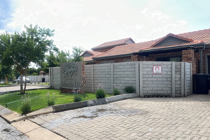 Ngwenya River Estate Townhouse For Sale: Private garden, clubhouse, 24/7 security, near Brits Mall.