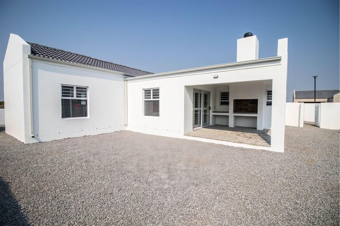 House For Sale in Velddrif Central: Beach access, secure estate, included plot.