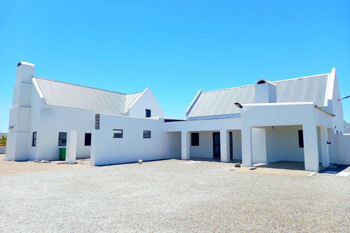 House for Sale in Jacobsbaai: Open-plan living, cottage, braai areas, secure yard.