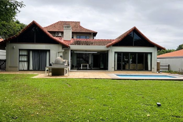 For Sale: House in Port Zimbali Estate with pool, entertainment area, and solar panels.