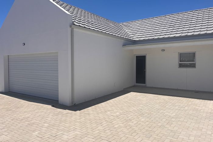 House For Sale in Velddrif Central: 3 bedrooms, double garage, patio, and braai.