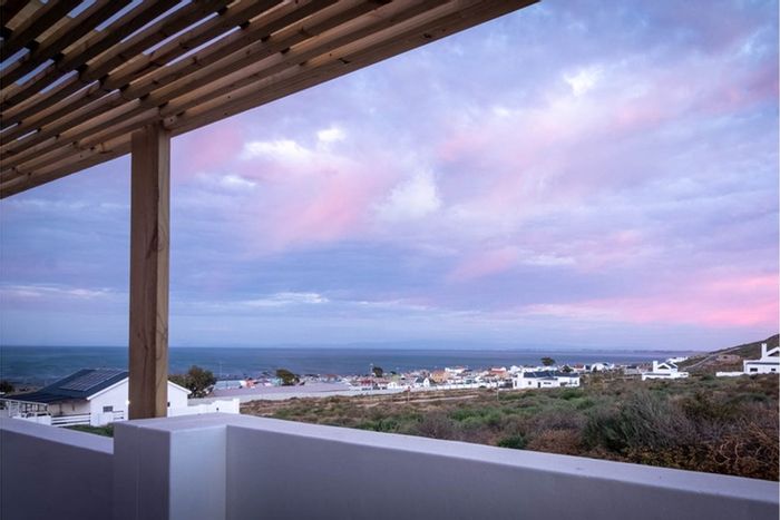 Eco-friendly house for sale in Steenbergs Cove with security and solar features.