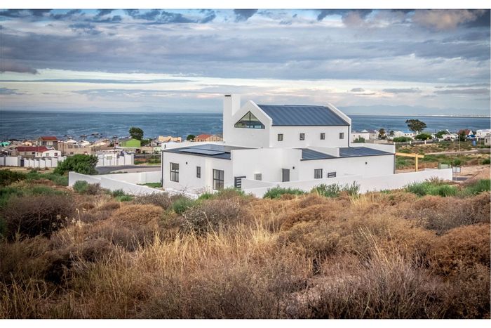 Eco-friendly house for sale in Steenbergs Cove with sea views and security features.