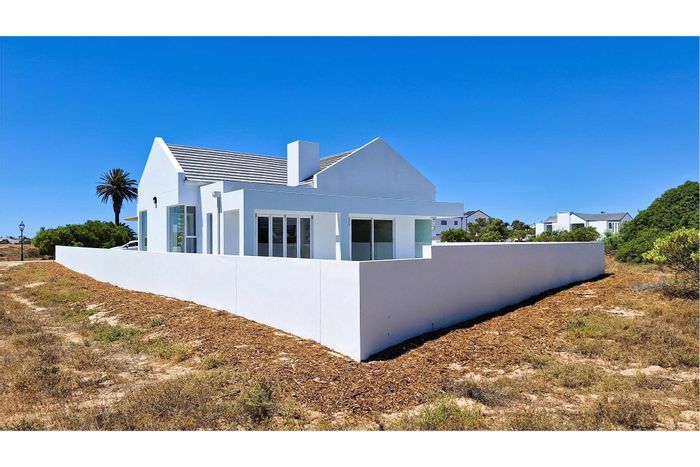 Golf course views, gourmet kitchen, 24-hour security in Shelley Point house for sale.