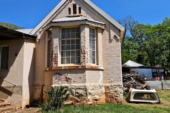For Sale: Barberton Central house, 4 bedrooms, 2 baths, ample parking, spacious lot.