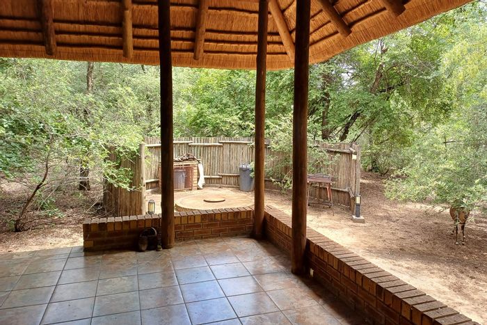 House For Sale in Marloth Park Central: Air-conditioned, spacious living, garage, and wildlife views.