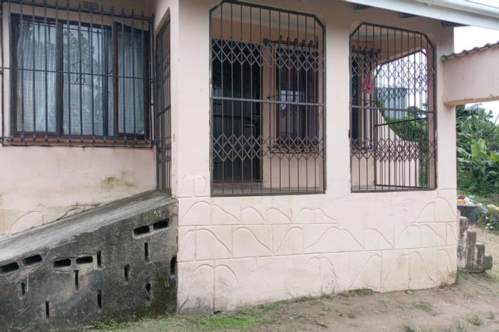 Umlazi L House For Sale: Two bedrooms, spacious yard, outbuilding, and veranda.