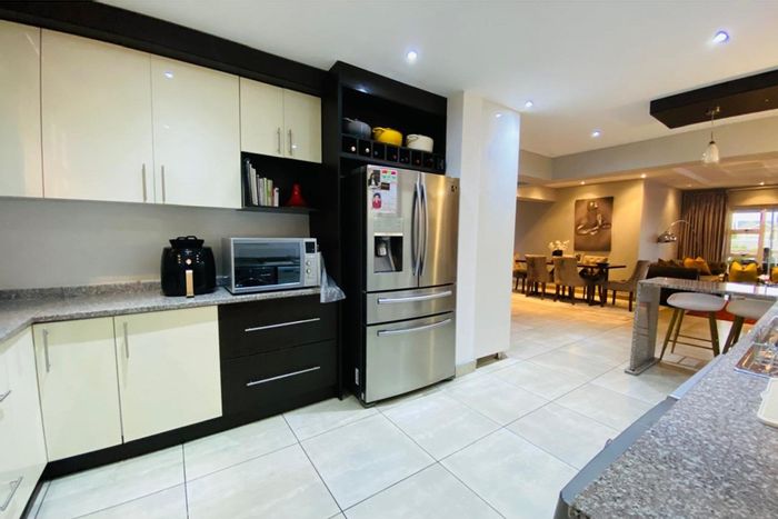 House For Sale in Riverspray Lifestyle Estate: Open-plan living, patio, communal amenities.