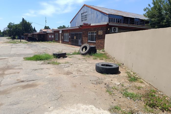 Industrial Property For Sale in Stilfontein Central: Versatile space with loading bays and office area.