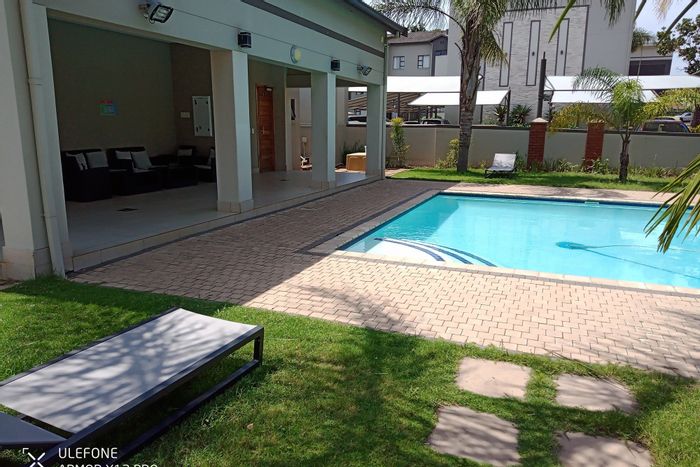 For Sale: 2-Bedroom Apartment in New Town Centre with pool, gym, and security.