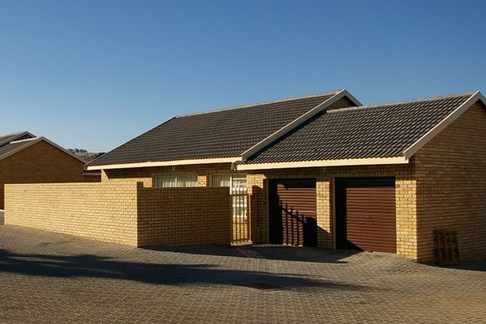 For Sale: Townhouse in Pioneer Park with 3 bedrooms, double garage, and backyard.