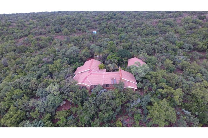 Farm for Sale in Bela Bela Central: 5 beds, multiple chalets, mountain views.