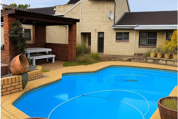 For Sale: House in Sunnyridge with 4 bedrooms, pool, and dual garages.