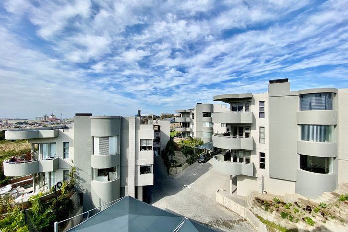 For Sale: Apartment in Island View with en-suite bedrooms, balcony, pool, and braai area.