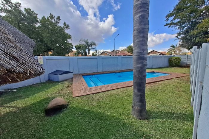 Rooihuiskraal North Townhouse For Sale: 2 Bedrooms, private garden, open-plan living.