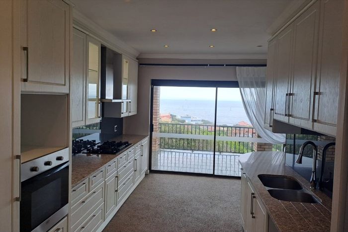 Versatile house in Blue Horizon Bay for sale, features ocean views and separate quarters.