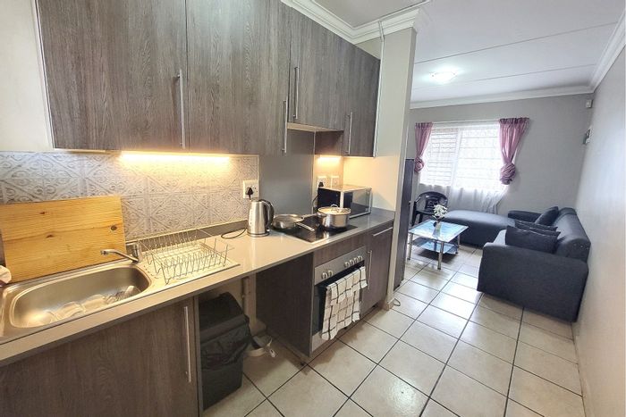 Ground floor 2-bedroom apartment for sale in Belhar with secure parking and 24-hour security.