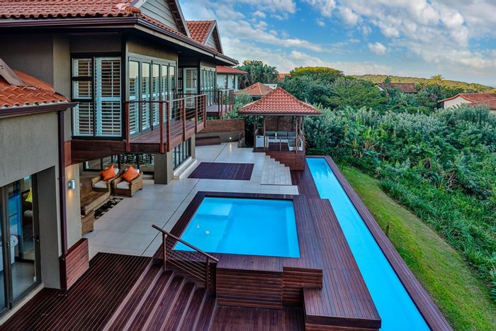 Zimbali House For Sale: 4 beds, pool, golf cart garage, eco-friendly features.