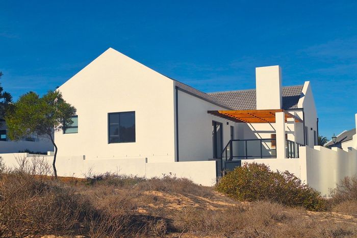 For Sale: House in Shelley Point with golf course views, patio, and clubhouse access.