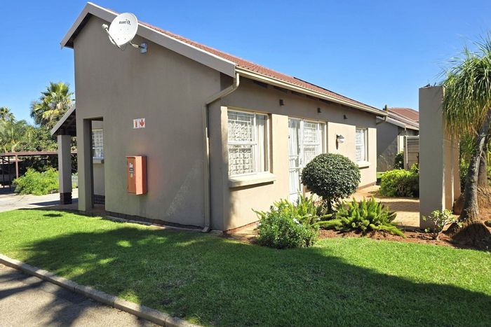 For Sale: Townhouse in Bonaero Park with clubhouse, pool, and double carport.