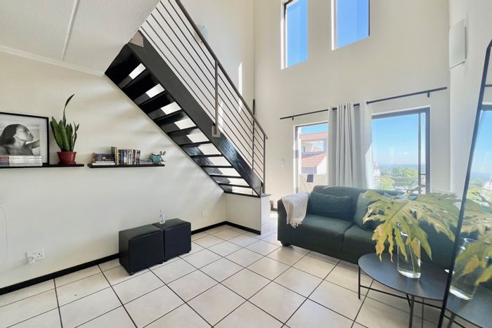 Bryanston Apartment For Sale: Loft, two balconies, pool, security, and parking.