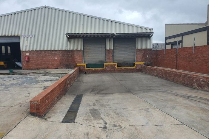 Industrial warehouse in Deal Party to rent, featuring large yard and multiple loading bays.