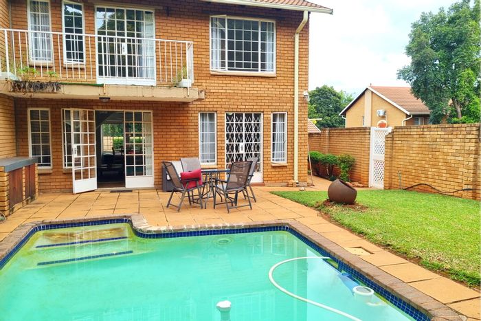 4-Bedroom Townhouse To Rent in Faerie Glen with Pool, Garden, and Garage.