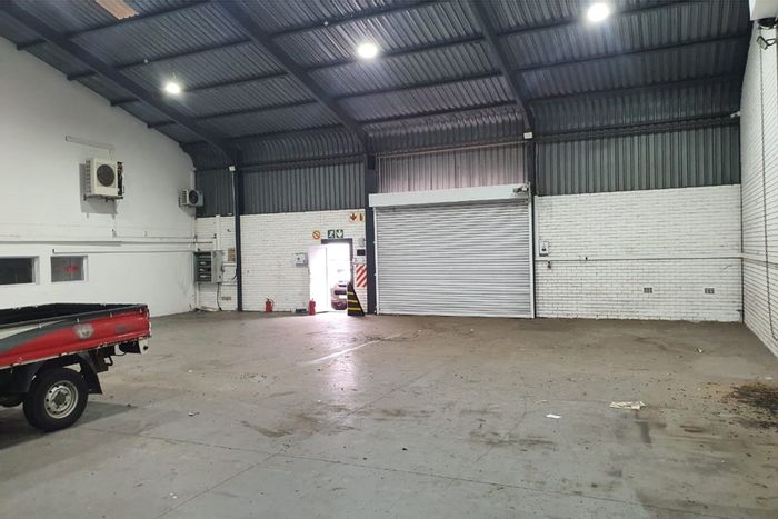 Industrial warehouse in Newton Park to rent, featuring high ceilings and secure access.