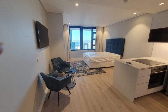 Apartment For Sale in Cape Town City Centre: Rooftop pool, gym, and concierge services.