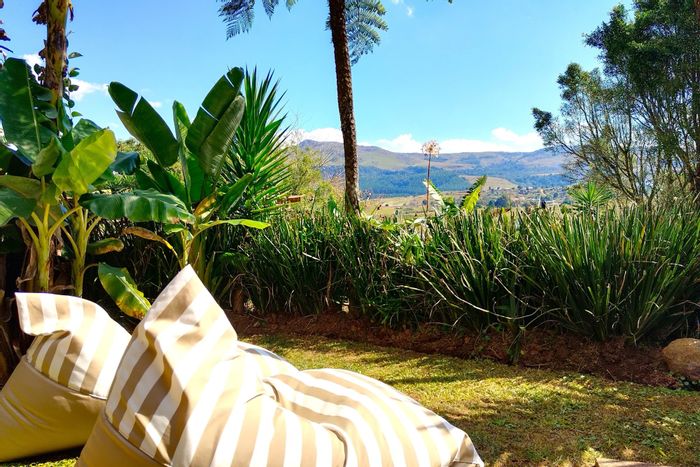 Graskop Central Guest House For Sale: Luxury units, jacuzzi, mountain views, income potential.