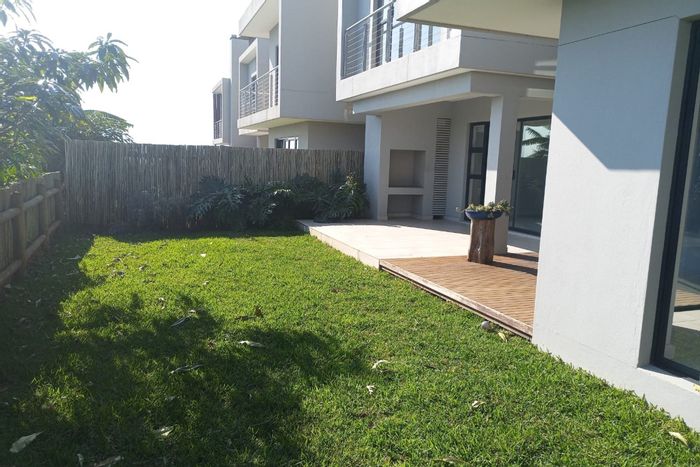 Spacious 4-bedroom townhouse in Shakas Rock with pool, garden, and security. To Rent.