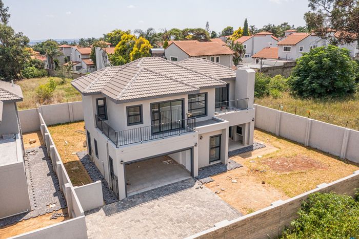 For Sale: House in North Riding with 3 bedrooms, ensuite baths, and wrap-around garden.