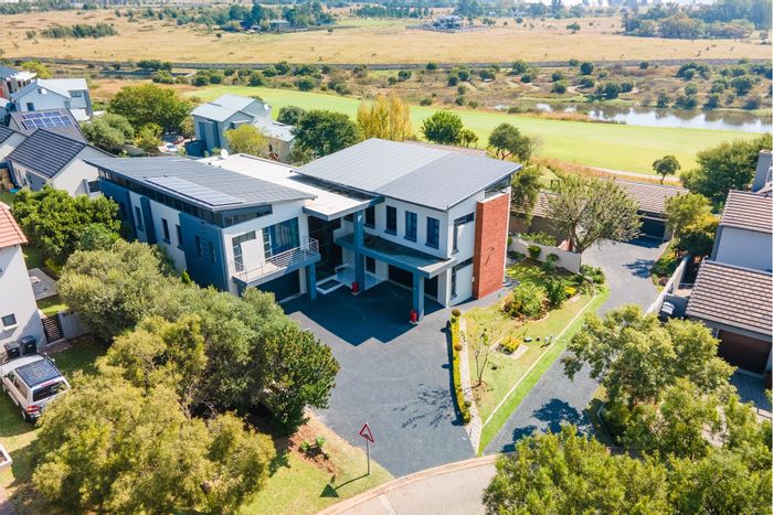 For Sale: House in Copperleaf Estate with pool, guest suite, and golf views.
