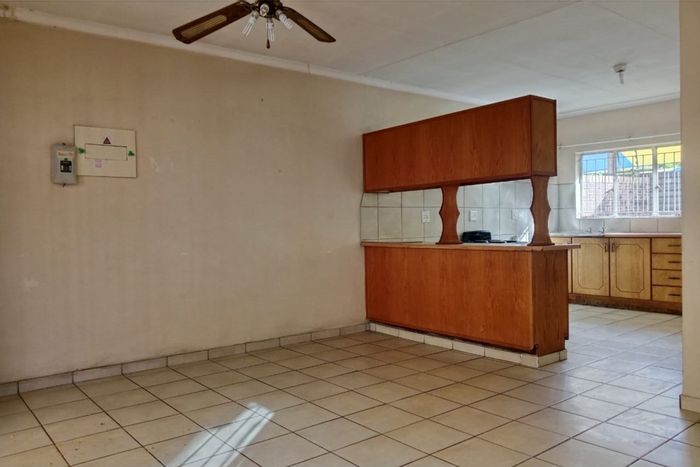 Two-bedroom apartment to rent in Rustenburg Central with garage and courtyard.