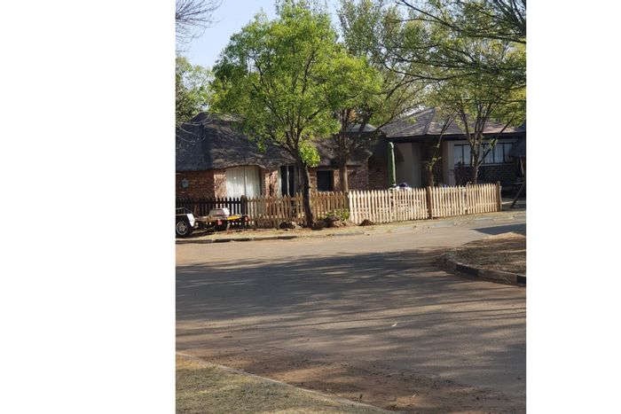 For Sale: 4-bedroom house in Orkney Rural with garden, garage, and braai pit.