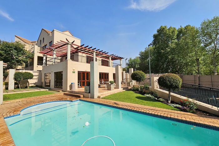 For Sale: Townhouse in Paulshof with clubhouse, pool, tennis court, and security.