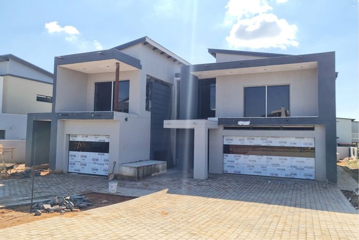 For Sale: House in Six Fountains Estate with pool, garages, and security.