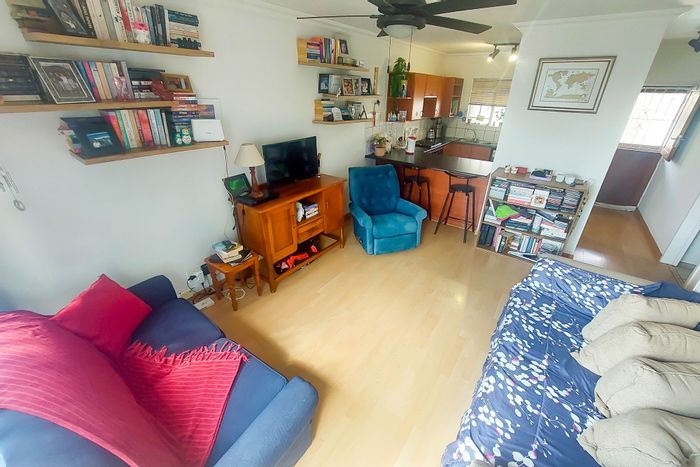 1-Bedroom Apartment For Sale in Rooihuiskraal North with 24-hour security and balcony.