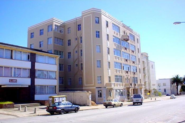 For Sale: Apartment in Port Elizabeth Central with balcony, secure block, rental income.