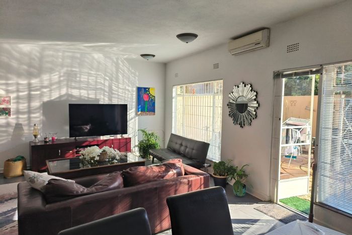 For Sale: Spacious 3-Bedroom Townhouse in Malanshof with Garden and Secure Parking.