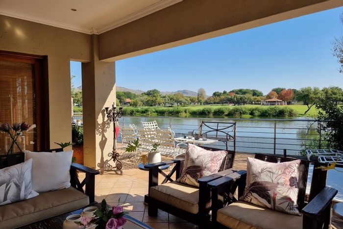 For Sale: House in Pecanwood Estate with golf course, clubhouse, and dam views.