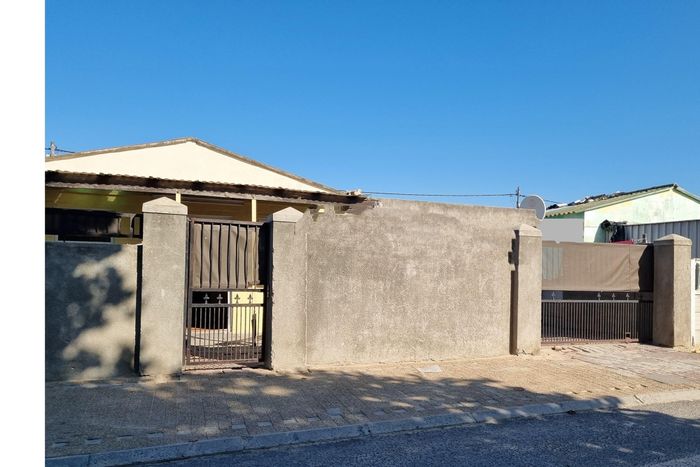 For Sale: Spacious 4-bedroom house in The Hague with double garage and fenced yard.
