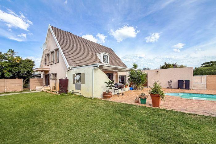 Bothasig House For Sale: 4 bedrooms, pool, double garage, eco-friendly features.