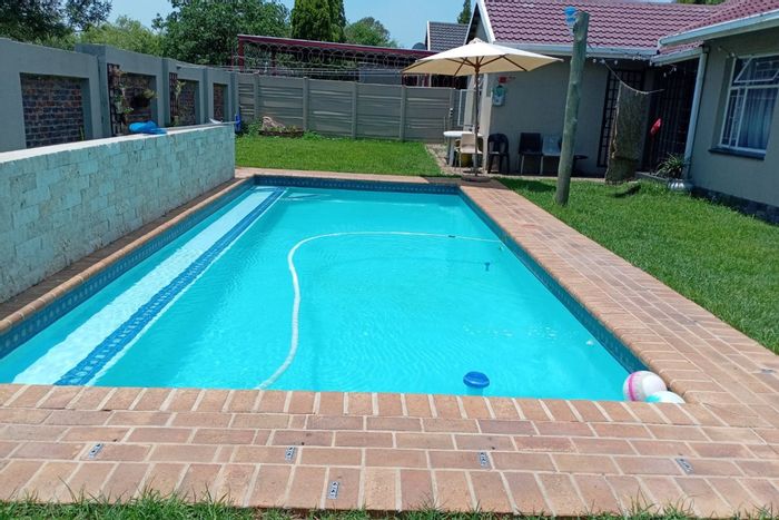 4-Bedroom House For Sale in Secunda Central with Pool, Garden, and Security.