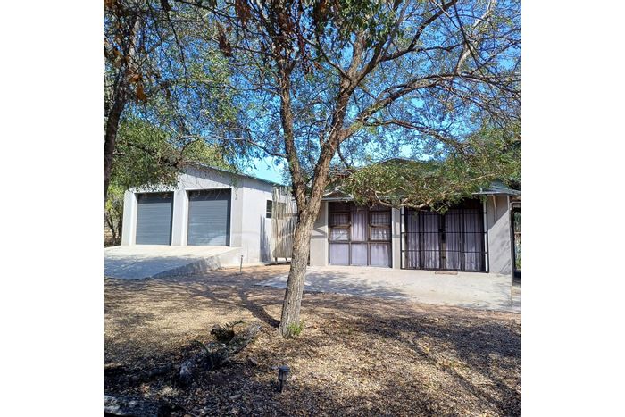 House for Sale in Marloth Park Central: 2 beds, flat, pool, parkland views.
