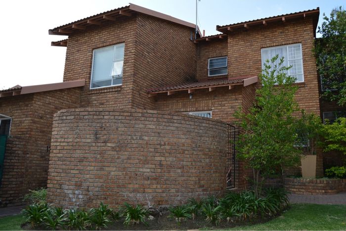 For Sale: Townhouse in Halfway Gardens with prepaid utilities, garden, and nearby schools.