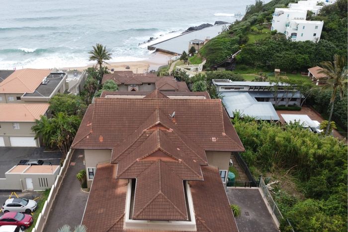 For Sale: Beachfront Apartment in Shakas Rock with 4 Bedrooms, Office, and Garage.