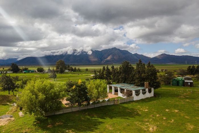 Gouda Farm For Sale: Riverfront, multiple accommodations, pool, stables, and barns.