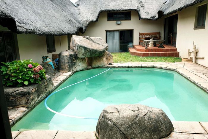 Zwartkop House For Sale: Double garage, bar area, pool, indoor gym, loft space.